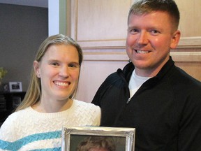 Melissa and James Grasse stand with a photo of James' mom Sandra Grasse, who died in April, 2012. She donated her corneas to a young girl by being a registered tissue donor with the Trillium Gift of Life Network. (TYLER KULA, The Observer)