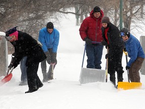 Bicycle enthusiasts clear the Seine River footbridge on Tuesday. (Brian Donogh/Winnipeg Sun)