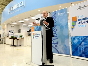 Alberta Minister of Health Fred Horne takes part in a press conference to announce a new agreement that allows pharmacies to offer more services, at the pharmacy in the Real Canadian Superstore, 12350 - 137 Avenue, in Edmonton, Alta., on Tuesday Feb. 11, 2014. David Bloom/Edmonton Sun