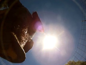 A pig discovers a GoPro camera in its pen after it fell from an airplane. (YouTube screengrab)