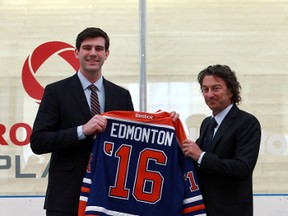 Edmonton Oilers owner Daryl Katz (r) presents Edmonton Mayor Don Iveson a Oilers jersey after speaking to the public on the new arena during a press conference at city hall  in Edmonton, AB., on Tuesday, Feb 11, 2014.  Perry Mah/   Edmonton Sun/ QMI Agency