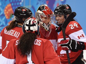 Canadian women's hockey team
Beat U.S. 3-2.
Canada sits 3-0. Will play in semifinal on Monday. (Didier Debusschere/QMI Agency)