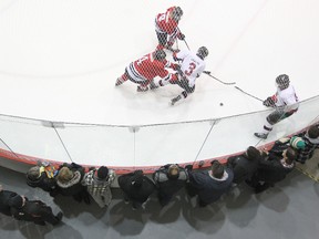 Fans take in a AAA Midget game between the Winnipeg Hawks and Winnipeg Monarchs at MTS Iceplex last month. Hockey Winnipeg will force parents to complete an online course on respecting the game before they can register their children next season. (Kevin King/Winnipeg Sun file photo)