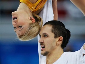 Russia's Tatiana Volosozhar and Maxim Trankov compete during the figure skating pairs free skating program at the Sochi 2014 Winter Olympics, Feb. 12, 2014. (ALEXANDER DEMIANCHUK/Reuters)