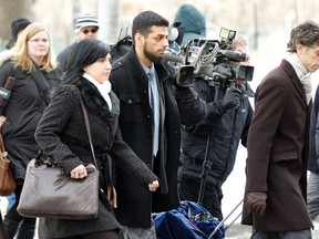 Dr. Khurram Syed Sher, centre, was arrested in 2010 with one count of conspiring to facilitate a terrorist activity at CFB Trenton. - QMI AGENCY