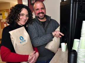 Patrick Dunham, owner and lead roaster of Kingfisher Coffee, pours a cup of coffee next to Silvia Langer, development director at The Unity Project, Feb. 12, 2014 at the Unity Project in London Ont. Dunham announced that Kingfisher will be donating 1 per cent of its total roast volume to the Unity Project and Mission Services. CHRIS MONTANINI\LONDONER\QMI AGENCY