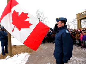 Air Cadets raise the Canadian Flag during a flag raising ceremony at Government House in Edmonton, Alta., on Wednesday Feb. 12,  2014.  Two Edmonton schools joins Lt. Gov. Donald S. Ethell in a National Flag of Canada event to honour the Maple Leaf.  Perry Mah/Edmonton Sun