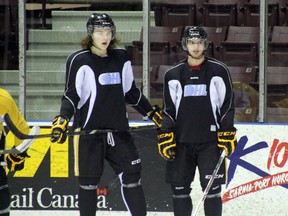 Anthony DeAngelo (right) returned to Sarnia Sting practice on Wednesday, Feb. 12 ahead of Sarnia's game against the London Knights on Thursday evening. DeAngelo, who was facing internal discipline, has been a healthy scratch for the Sting since their game against the Guelph Storm on Friday, Jan. 31. SHAUN BISSON/THE OBSERVER/QMI AGENCY