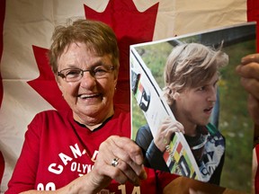 Proud grandmother Lauri Baxter poses with a photo of her grandson, Canadian Olympic ski jumper Dusty Korek, at the Westend Seniors Activity Centre in Edmonton, Alta., on Wednesday, Feb. 12, 2014. Korek made the trip to Sochi. (Codie McLachlan/Edmonton Sun/QMI Agency)