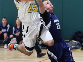 Austin Beange of College Notre Dame tries to block a shot from Adrian Kuchtaruk of the Lockerby Vikings during senior boys division 1 semi-final action from Lockerby Composite School on Wednesday evening.