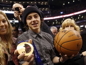 Canadian Olympic bronze medallist for slopestyle Mark McMorris added a free slice of pizza to his memorable week as he was at the ACC to see the Raptors beat the Hawks, 104-83. Fans get free pie if the hosts score more than 100 points and win. (MICHAEL PEAKE/TORONTO SUN)