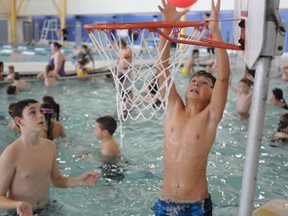 Noah King, 12, attempts a slam dunk in the YMCA pool in this file photo from last year's  Family Day. The YMCA Jerry McCaw Family Centre is again hosting Family Day activities on Monday. Other special events are planned around Sarnia-Lambton. (THE OBSERVER / QMI AGENCY)