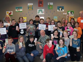 Brian Salt (middle) founder of Salthaven Wildlife Rehabilitation and Education Centre located in Mount Brydges receives a donation of over $1,200 courtesy a funding drive engineered through educational assistant Diane Penny (left), students, staff and principal Ron Van Belois (right) at Caradoc Public School Feb 12. Money raised will help Salt and his staff of volunteers continue to work with over 1,000 animals per year.
JACOB ROBINSON/AGE DISPATCH/QMI AGENCY