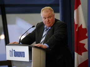 Toronto Mayor Rob Ford speaks to media at City Hall Thursday, February 13, 2014. (Michael Peake/Toronto Sun)