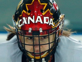 Canadian goaltender Genevieve Lacasse looks on during a women's  hockey team practice in Sochi, Russia, on Feb. 5. Lacasse, a member of the Canadian women's Olympic hockey team, was named Kingston's amateur athlete of the year for 2013 on Thursday night. (Jim Young/Reuters)
