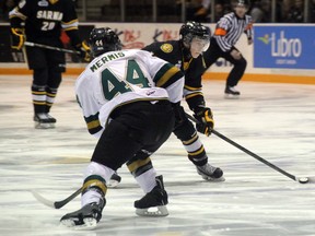 Vladislav Kodola of the Sarnia Sting (in black) gets ready to fire off a wrist shot in the first period of action between the Sting and the London Knights on Thursday, Feb. 13 at the RBC Centre. Kodola was named the game's hardest working player, in an 11-0 loss to London. SHAUN BISSON/ THE OBSERVER/ QMI AGENCY