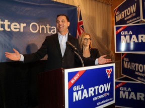 Ontario PC Leader Tim Hudak with candidate Gila Martow as they arrive at her campaign party after she won the byelection in the Thornhill riding n Thursday February 13, 2014. (Michael Peake/Toronto Sun)