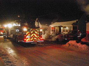 St. Thomas firefighters responded to a house fire on Yarwood St. in St. Thomas Thursday night. The home was significantly damaged and a bird died in the blaze. Ben Forrest/Times-Journal