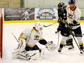 The Eagles Clayton Wilburn and defenceman Rob Hayne combine to shut down a Bentley scoring chance. - Gord Montgomery, Reporter/Examiner