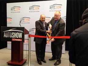 Rob Ford cuts ribbon to officially open the Canadian International Auto Show in Toronto. (DON PEAT/Toronto Sun)
