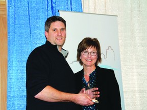 Business Entrepreneur/Owner/Manager of the Year Award winner Chad Gropp, left, recieves his award at the 2014 Kenora District Chamber of Commerce Business Awards banquet on Wednesday night, Feb. 12.