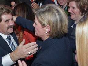 NDP candidate Wayne Gates and NDP Leader Andrea Horwath celebrate their victory after Gates, a Niagara Falls city councillor, was elected MPP on Thursday Feb. 13, 2014. (QMI Agency)