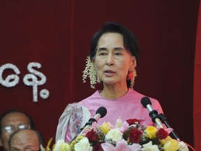 Myanmar opposition leader Aung San Suu Kyi delivers a speech during a ceremony to mark the country?s 66th Independence Day at the National League for Democracy headquarters in Yangon last  month. (SOE THAN WIN/AFP PHOTO)