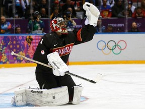 Canada's goalie Roberto Luongo makes a save against Austria during their men's preliminary round hockey game at the 2014 Sochi Winter Olympic Games, Feb. 14, 2014. (PHIL NOBLE/Reuters)