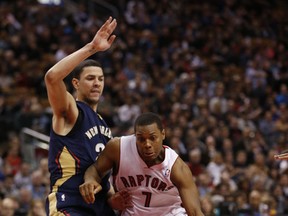 Toronto's Kyle Lowry drives against New Orleans' Austin Rivers on Feb. 10, 2014 at the Air Canada Centre. (MICHAEL PEAKE/Toronto Sun)