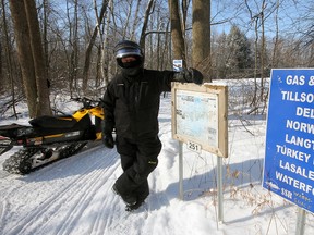 Southern Sno Riders president Henry Spanjers, photographed at a junction just north of Courtland, says OFSC trails offer significant advantages, including smooth, groomed riding; maps, and signage featuring helpful information including food and gas options. He also extended an open invitation to the warming shed between Courtland and Langton Sunday, site of the Sno Riders annual hot dog day.