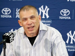 New York Yankees manager Joe Girardi (28) talks with the media as pitchers and catchers report for spring training at George M. Steinbrenner Field on Feb 14, 2014 in Tampa, FL, USA. (Kim Klement/USA TODAY Sports)