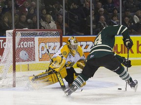 Sarnia Sting goaltender Taylor Dupuis keeps an eye on London Knights forward Ryan Rupert as he bears down on the net during their Ontario Hockey League game at Budweiser Gardens on Friday. The Knights won 9-5. (CRAIG GLOVER, The London Free Press)