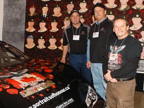Artist Dave Sopha has spent eight years painting his massive mural, Portraits of Honour, which pays tribute to the 158 Canadian soldiers killed in Afghanistan. Race car driver Gord Bennett and his dad Pete are helping to raise money so that Sopha can take his mural on a cross country tour. (Chris Doucette/Toronto Sun)