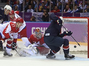 Team USA's Cam Fowler scores on Russia's goalie Sergei Bobrovski during second period action at the 2014 Winter Olympic Games, in Sochi, Russia, on Saturday February 15, 2014. (Al Charest/QMI Agency)
