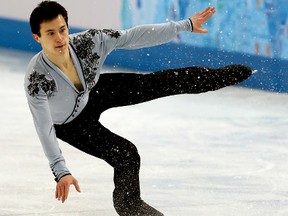 Patrick Chan of Toronto, Ontario, has an uneven landing during his performance during the Sochi 2014 Winter Olympics Men's Figure Skating Free Program at the Iceberg Skating Palace in Sochi, Russia, on Friday Feb. 14, 2014. Al Charest/QMI Agency