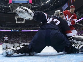 Russia's Pavel Datsyuk scores against Team USA's goalie Jonathan Quick during their men's preliminary round hockey game at the 2014 Sochi Winter Olympic Games, Feb. 15, 2014. (BRUCE BENNETT/Reuters/Pool)