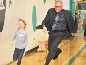 Erin Zadderey tries to evade Kevin Andrea, Northern Gateway School superintendent, during a game of Olympic tag on Monday, Feb. 10. 
Barry Kerton | Whitecourt Star