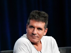 Judge Simon Cowell attends a panel for the television series "The X Factor" during the Fox portion of the Television Critics Association Summer press tour in Beverly Hills, California in this file photo from August 1, 2013. (REUTERS/Mario Anzuoni/Files)