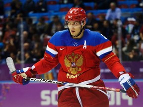 Russia's Alexander Ovechkin looks on during a break in play against Slovakia in their men's preliminary round ice hockey game at the Sochi 2014 Winter Olympic Games February 16, 2014. (REUTERS)