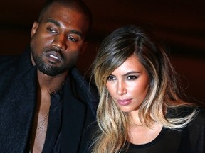 Kanye West and Kim Kardashian arrive at the Givenchy Spring/Summer 2014 women's ready-to-wear fashion show during Paris Fashion Week September 29, 2013. REUTERS/Charles Platiau