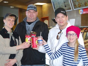 Coffee drinking patrons of the Samnah Crescent Tim Hortons in Ingersoll got a nice surprise Monday when coffee was given away for free courtesy of 401 Canada Auto RV. Left to right, Lori Salverda, owner of Tim Hortons, Jason Leuszler, finance manager at 401 Canada Auto RV, Patrick Taylor, owner of 401 Canada Auto RV and his daughter Porsha Taylor, 12.  TARA BOWIE / SENTINEL-REVIEW / QMI AGENCY