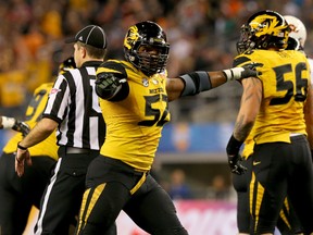 Michael Sam (52) of the Missouri Tigers reacts after the Oklahoma State Cowboys missed a 34-yard field goal during the AT&T Cotton Bowl January 3, 2014 in Arlington, Texas. (Ronald Martinez/Getty Images/AFP)