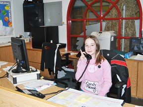 Whitecourt Central School Grade 5 student Kya Chartrand fills in the school’s office during her lunch break on Wednesday, Feb. 12.