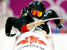 Canada's pilot Kaillie Humphries (front) starts a two-women bobsleigh training run at the 2014 Sochi Winter Olympics, Feb. 16, 2014. (ARD WIEGMANN/Reuters)