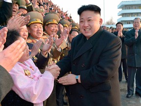 North Korean leader Kim Jong Un visits participants of a national agriculture competition in this undated photo released by North Korea's Korean Central News Agency (KCNA) in February 10, 2014. North Korean security chiefs and possibly even Supreme Leader Kim Jong-un himself should face international justice for ordering systematic torture, starvation and killings comparable to Nazi-era atrocities, U.N. investigators said on February 17, 2014.  REUTERS/KCNA/File