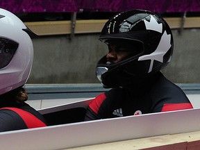 Canada's Justin Kripps (left) and Bryan Barnett at the end of their fourth run at the Sanki sliding Center, in Sochi, Russia, Feb. 17, 2014. (DIDIER DEBUSSCHERE/QMI Agency)