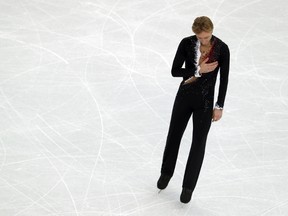 Two-time Olympic gold medalist Yvegeny Plushenko withdrew from the Sochi Olympics injured before competing in the men's figure skating short program. (AFP photo)