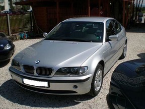 A silver, four-door 2004 BMW 320i is sought after its 26-year-old owner was beaten.