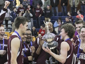 Members of the Frontenac Falcons senior boys basketball team celebrate after defeating the La Salle Black Knights 55-42 in the Kingston Area Secondary Schools Athletic Association final on Saturday at the Queen's Athletic & Recreation Centre. JULIA MCKAY/THE WHIG-STANDARD