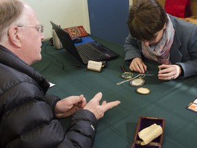 Don Barnes learned that the necklace he got from his mother was a mourning pendant, according to art consultant and Whig columnist Dr. Kamille Parkinson, at the Kingston Symphony's What's It Worth? event on Saturday. JULIA MCKAY/THE WHIG-STANDARD